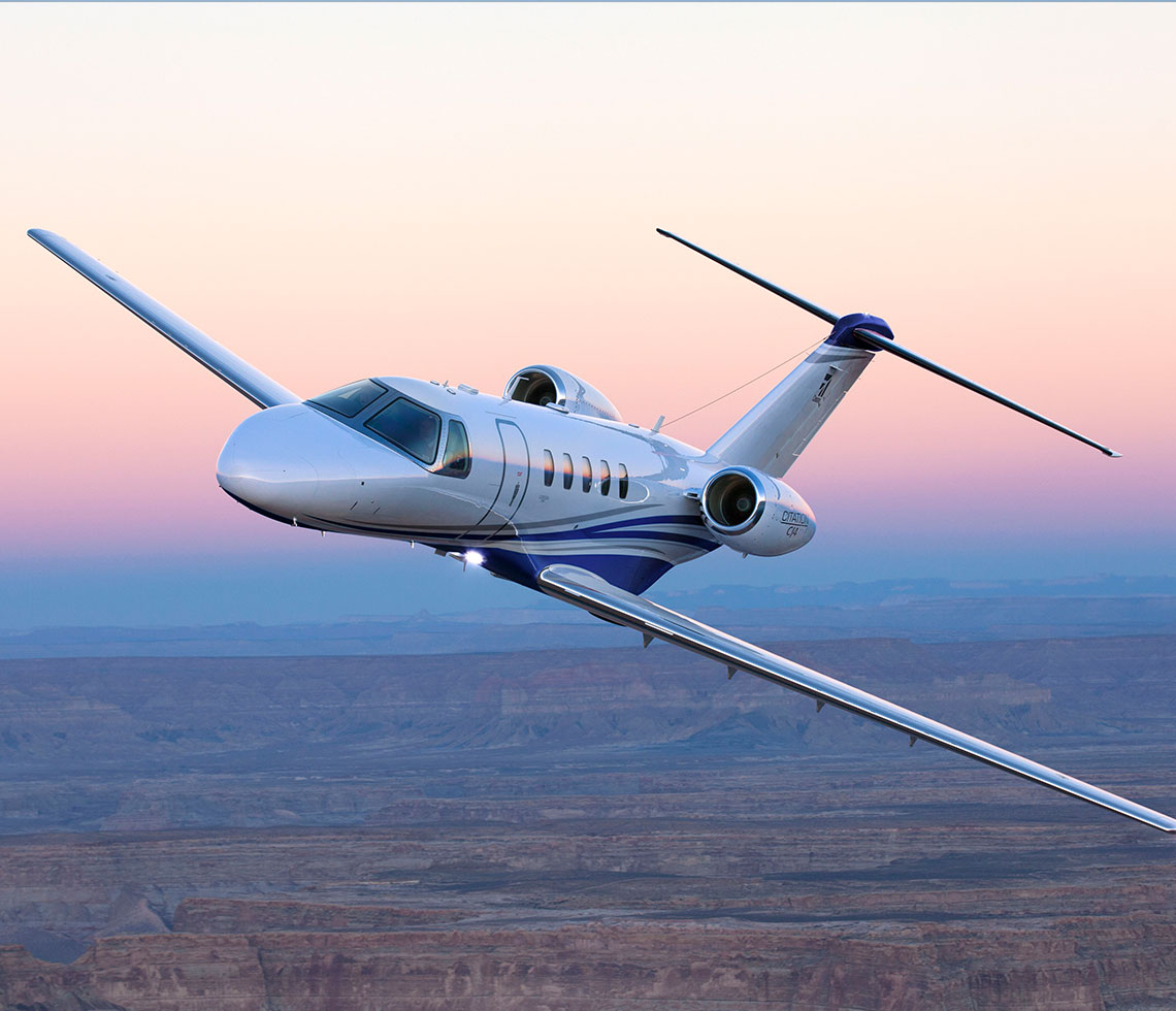 Cessna Citaiton CJ4 private jet flying during sunset