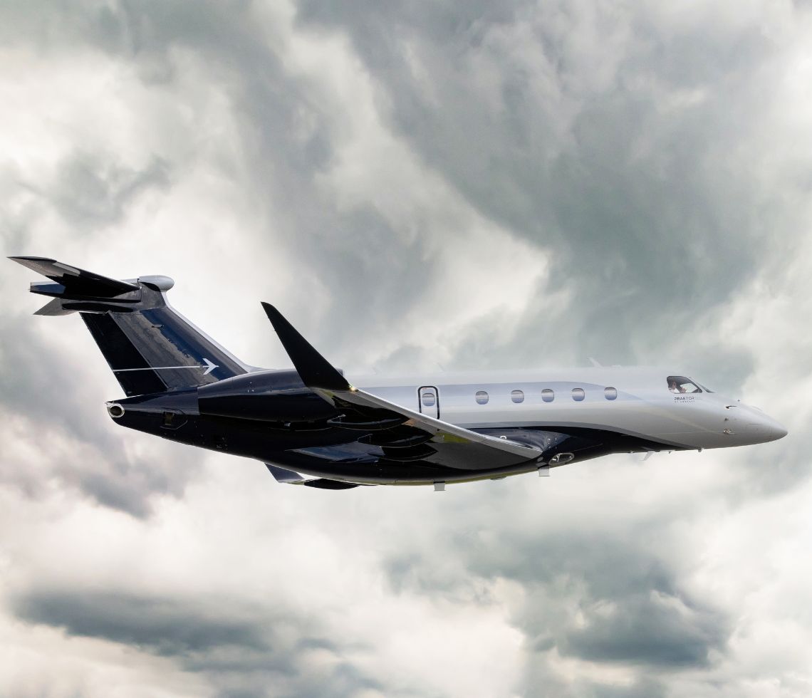 Embraer Praetor 500 private jet charter flying above the clouds