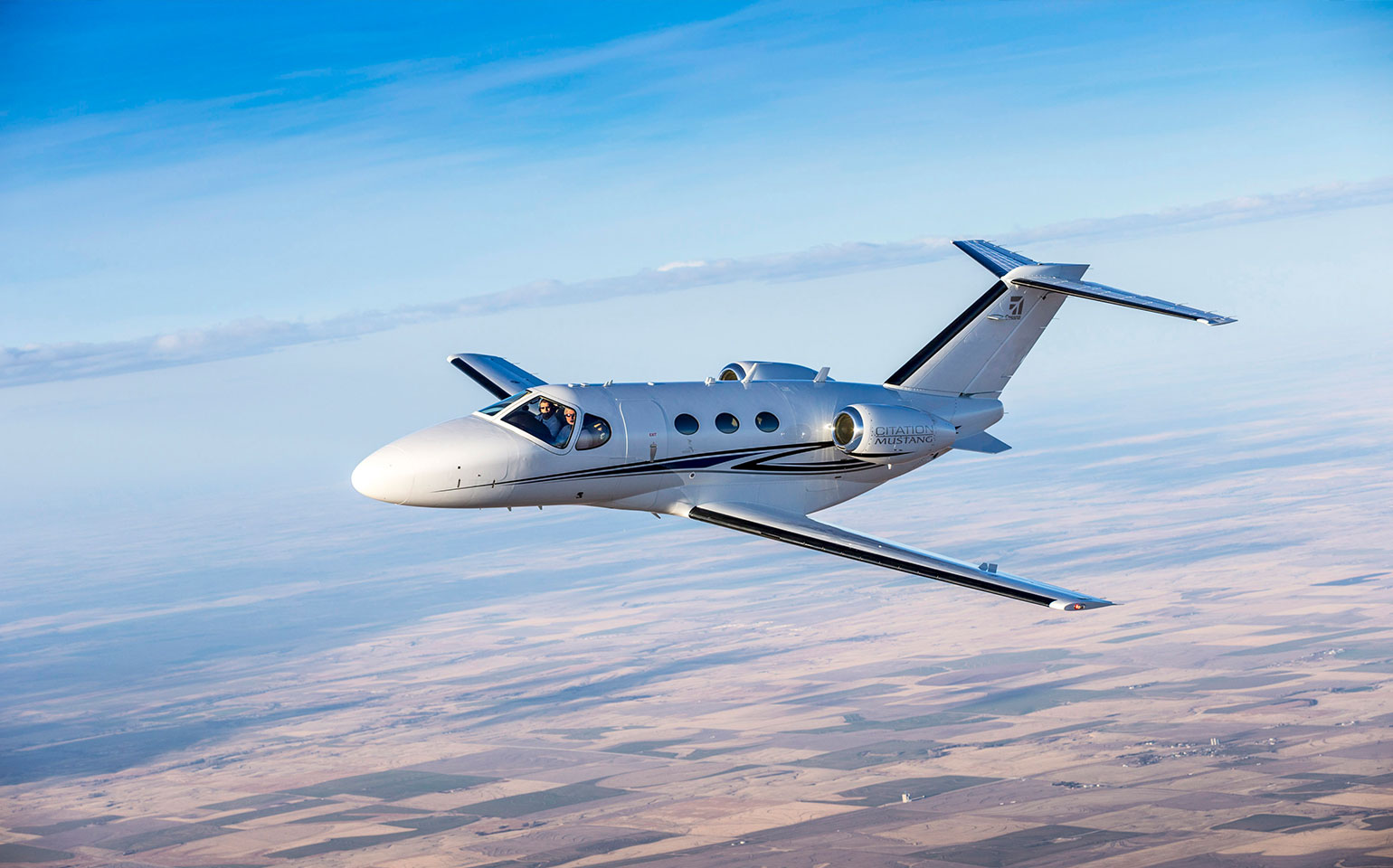 Cessna Citation Mustang flying in sky