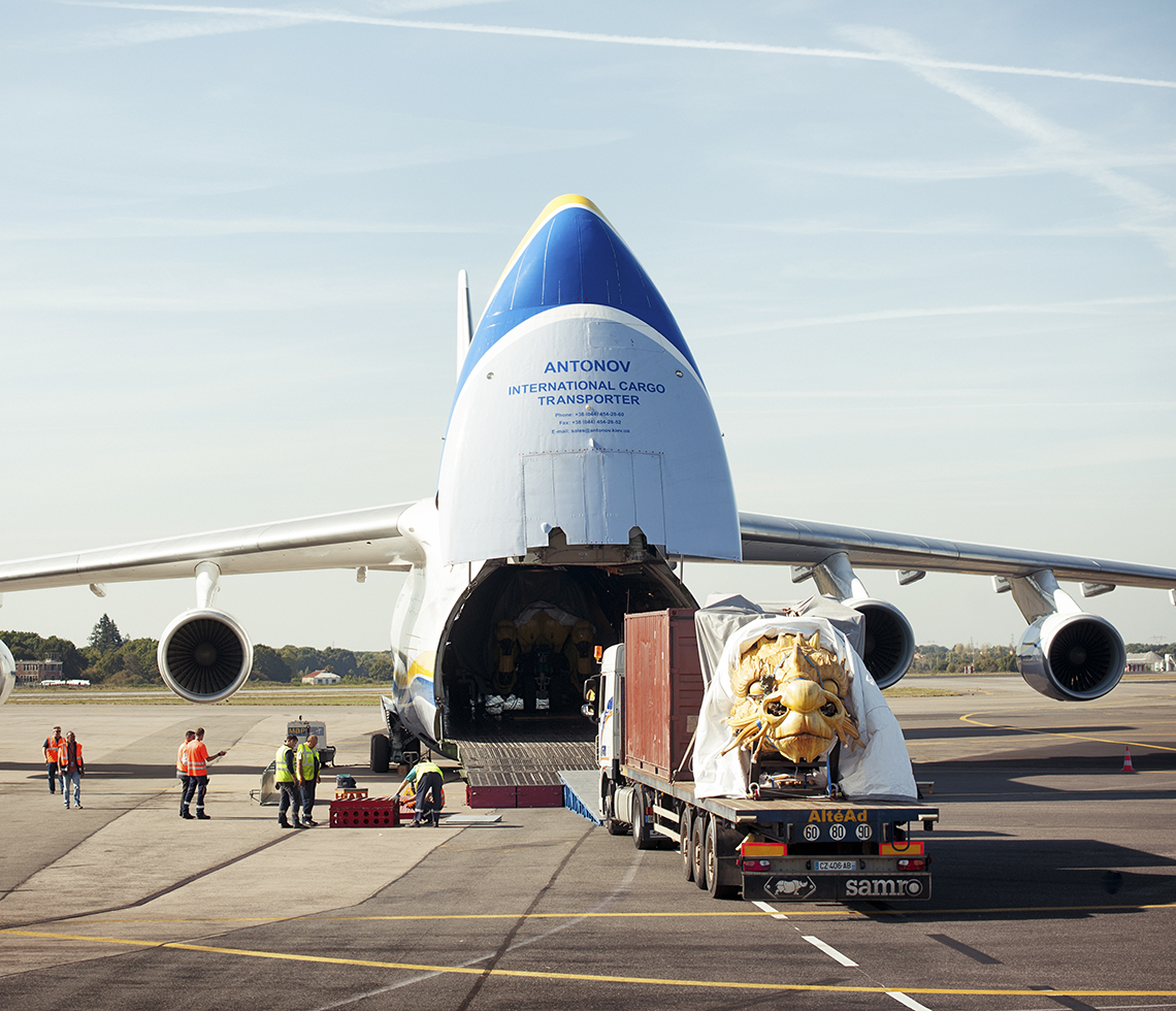 Antonov AN124 large cargo aircraft loading oversized freight in rear door