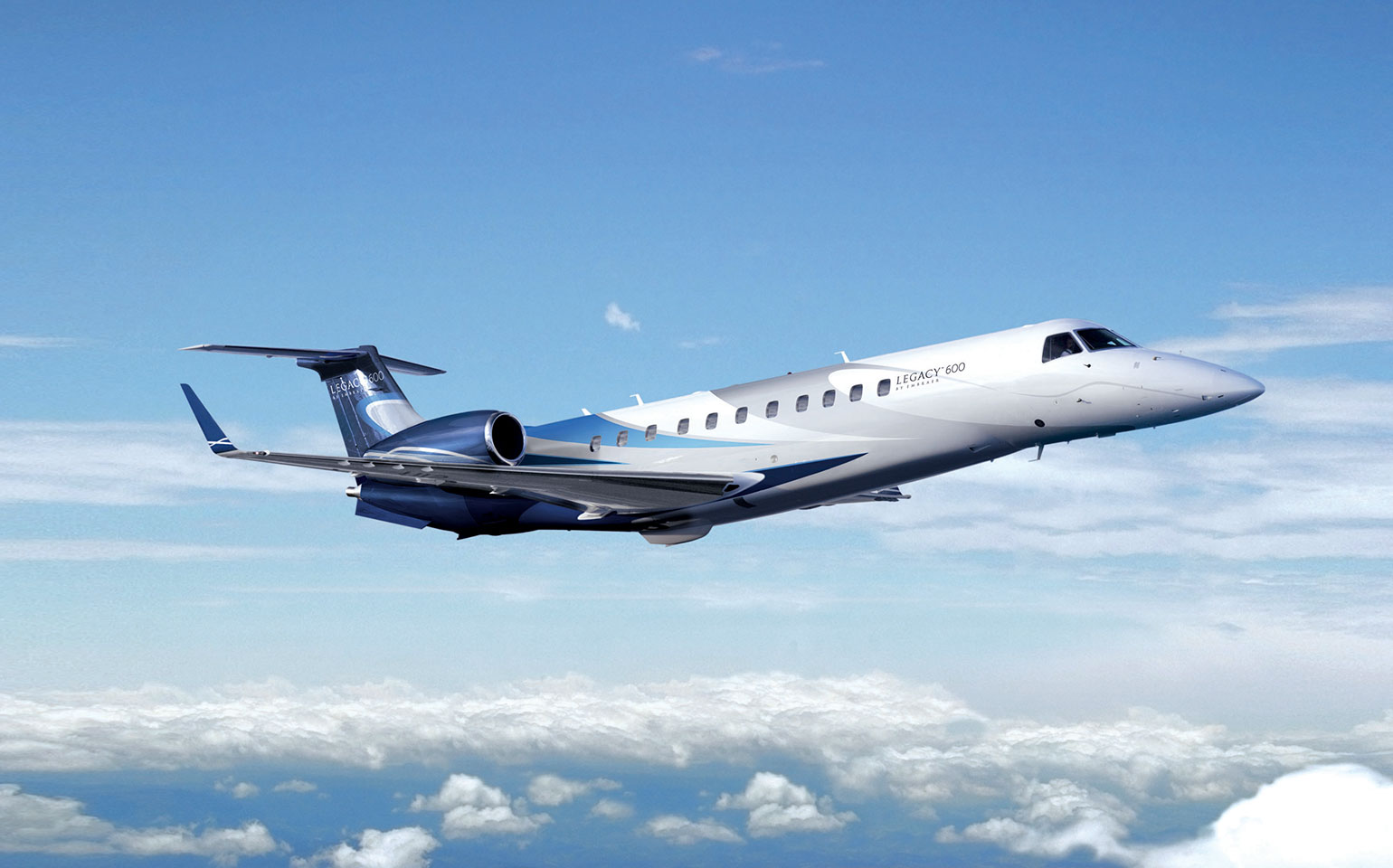 Embraer Legacy 600 private jet charter flight over clouds