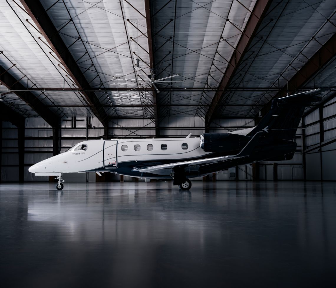 Embraer Phenom 300E inside hanger