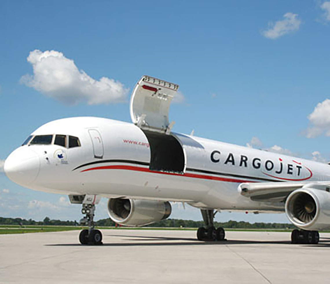Boeing B757F cargo charter aircraft with sideloading freight door open