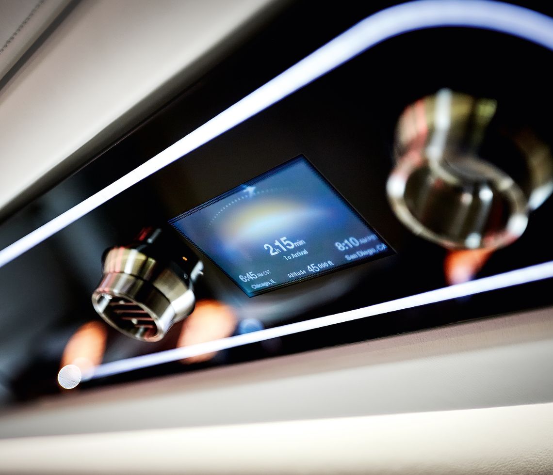 Embraer Praetor 500 private jet charter interior cabin control panel